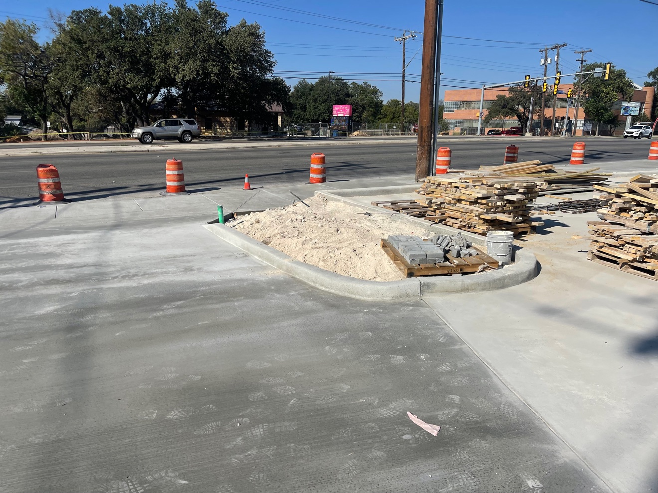 New concrete parking lot paving and curb at a commercial site