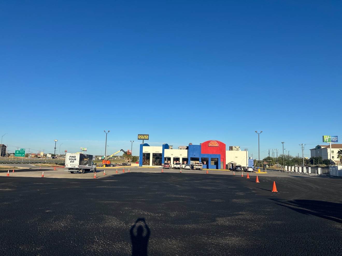 Freshly sealcoated asphalt parking lot
