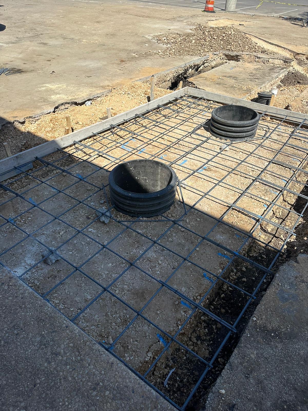 Utility pad prepped with a rebar grid and forms before the pour