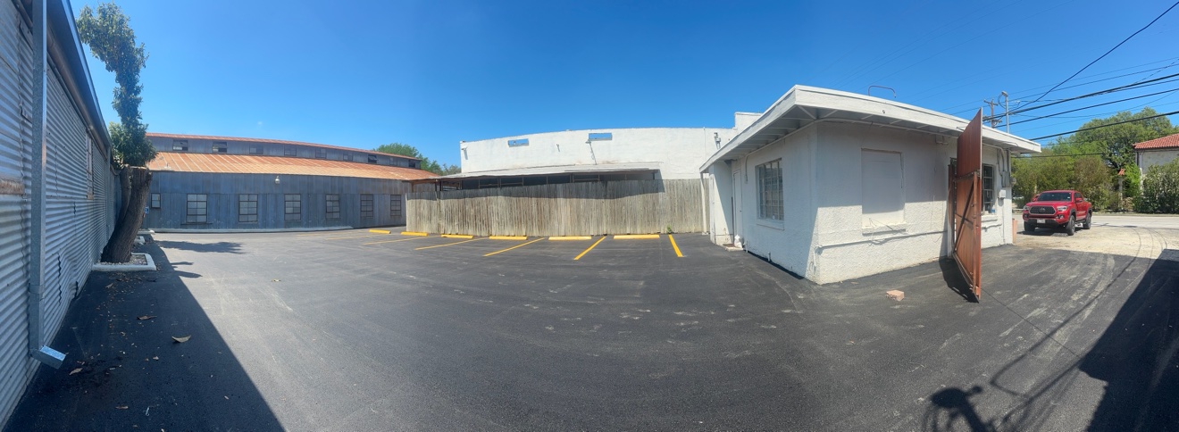 Panoramic view of a freshly paved and striped parking lot