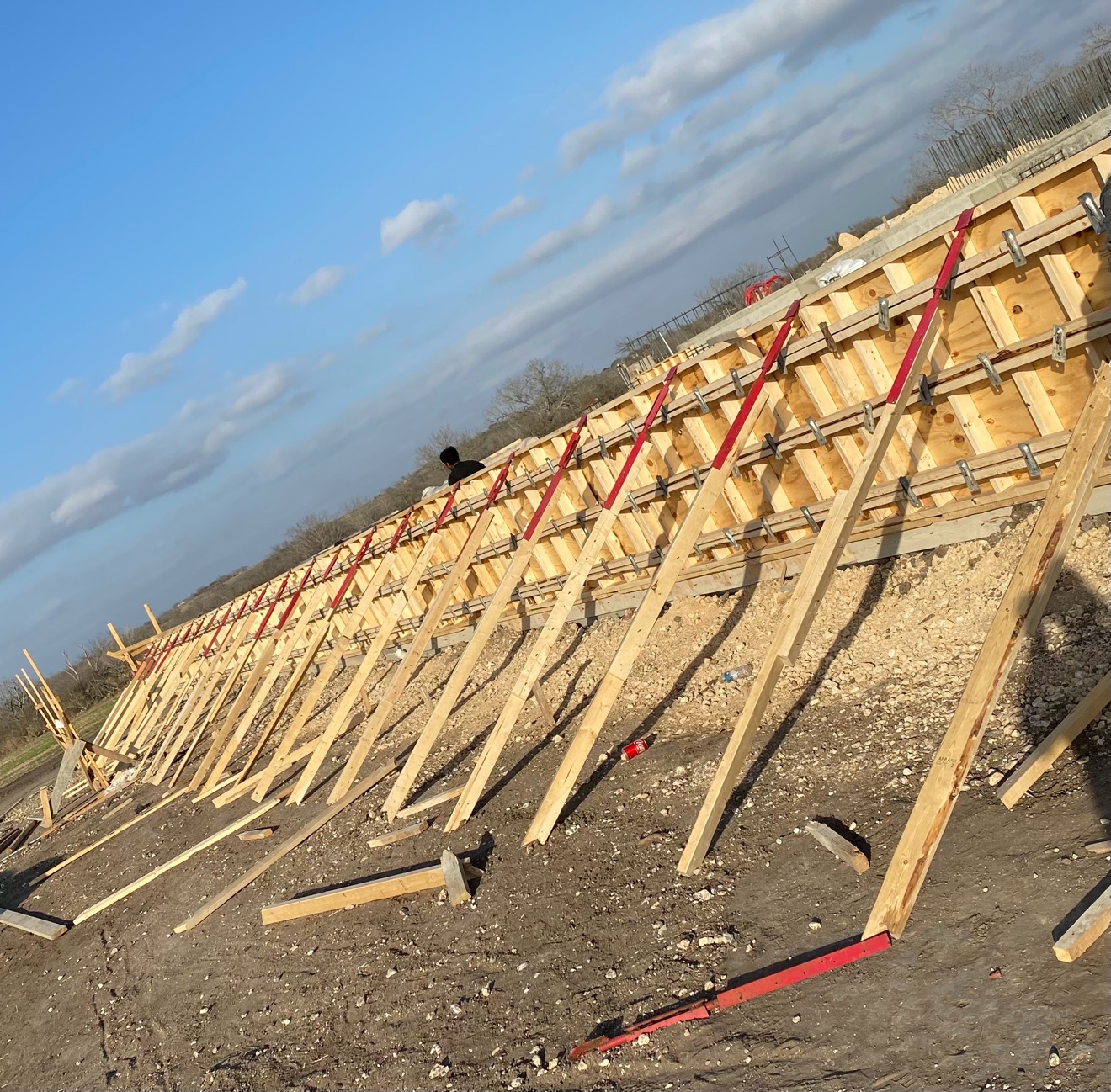 Tall wood wall formwork braced and ready for concrete